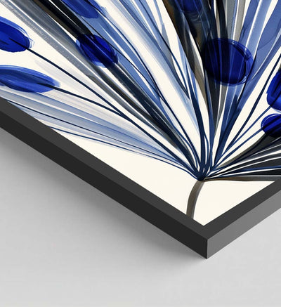 Close-up of a black frame encasing an abstract blue floral illustration, with a glossy pigment effect. The image highlights the meticulous finish and sharp details of the framed poster.