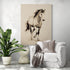 Large format painting of a horse drawn in ink, hung in a modern, minimalist living room with a white armchair, gray throw, and a green plant adding a natural touch.