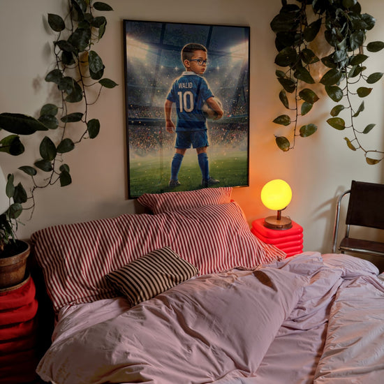 Framed personalized soccer poster above a bed in a cozy kids’ room