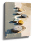 Impressionist-style zen pebbles on light sand canvas wall art