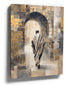 Canvas wall art of a silhouette in a striped shawl beneath an archway, warm golden tones, neutral boho decor