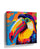 Large pop art toucan canvas wall art, tropical and colorful, decorative piece shown in a room setting