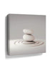 Minimalist Zen canvas wall art of stacked pebbles on white sand