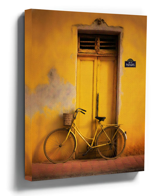 Yellow bicycle by a door – retro vintage canvas wall art in warm tones