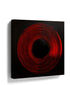 Abstract red concentric circle canvas wall art on a black background