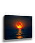 Realistic full moon over ocean canvas wall art in warm orange tones