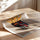 Poster Basquiat - Visage pop aux cheveux de frites en cuisine — Vierge - poster-enroullé — passe-partout blanc