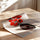 Poster Bouquet graphique - Fleurs rouges et vase noir tout en clarté — Vierge - poster-enroullé — passe-partout blanc