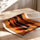 Poster Femmes africaines en procession - Dignité et transmission sur fond orange — Vierge - poster-enroullé — passe-partout blanc