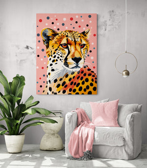 bright living space, comfortable chair, pink cushion and throw, modern side table, green plant, leopard artwork.