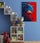 Sonic the Hedgehog video game canvas in kids room with shelves, books, toys and plush, blue wall