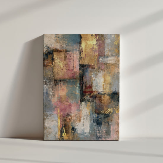Modern abstract wall art in gold, pink and blue on a white wall, clean minimalist styling