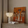 Tableau africain femmes portant fagots tons orangés décoration murale salon moderne