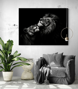 black and white lion and lioness photo canvas hung above an armchair