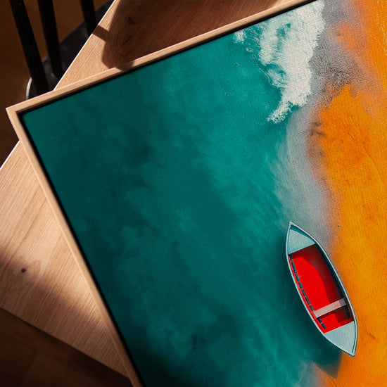 Boat at sea wall art for a minimalist living room, framed in golden oak