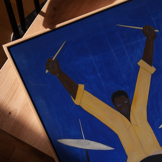 Drummer print in golden oak frame, minimalist electric blue background for modern interiors