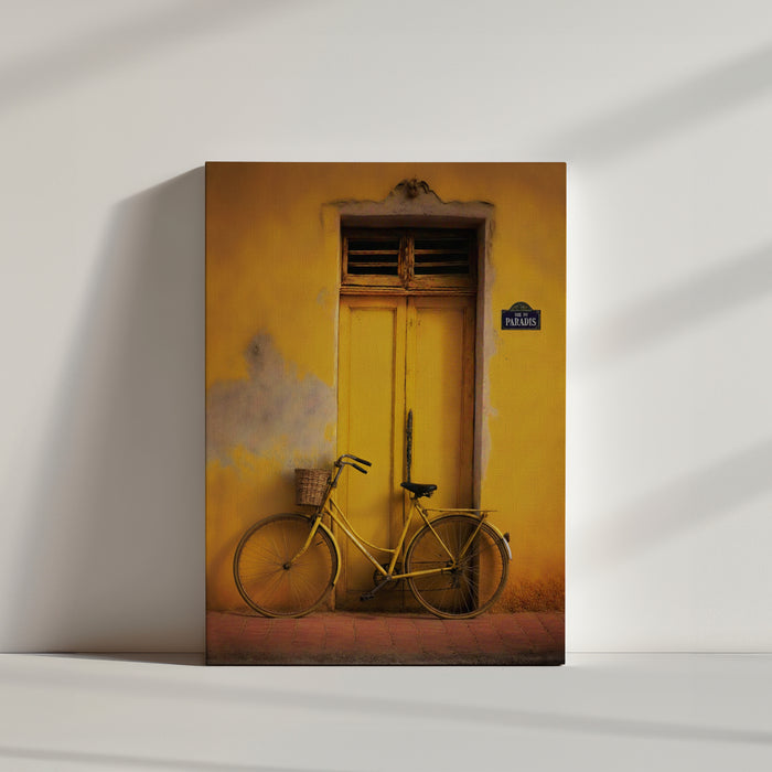 Yellow vintage bicycle leaning against a sunlit wall, Mediterranean style