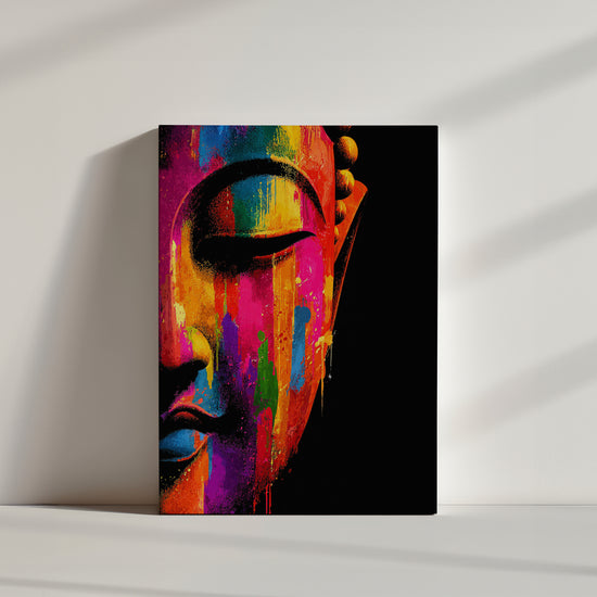 Modern Buddha canvas wall art with a close-up face and vibrant paint splashes on a black background