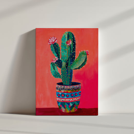 toile cactus en pot Botanique, fond rouge, pot coloré à motifs, style peinture.