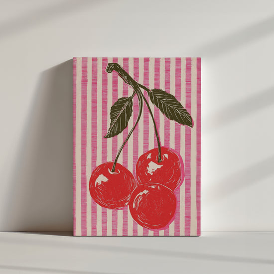Tableau mural rétro avec cerises rouges sur fond rayé rose, style pop art