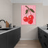 Art print featuring red cherries on pink striped background in a modern kitchen, pop art style