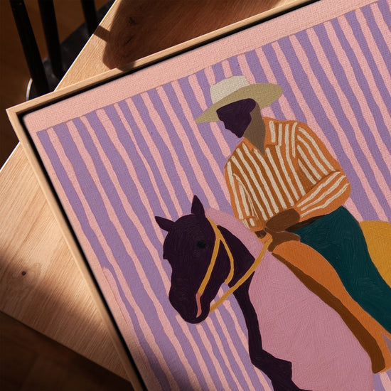 Framed horse and rider canvas, colorful striped style, modern wall decor with oak frame