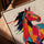 Dynamic colorful pop art horse canvas on a table with a golden oak frame, modern living room decor