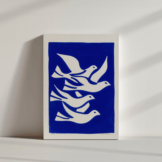 White doves on deep blue canvas print, minimalist bird wall art product photo
