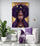 a canvas featuring a black woman with gold accessories in a minimalist white living room.