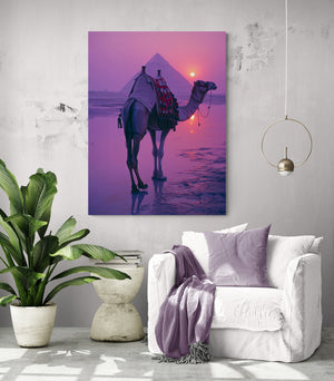 living room, comfy chair, purple cushion and throw, side table, large green plant, camel wall art.