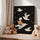 Canvas print showing a boy sitting on a white seagull flying through a black starry sky; soft, poetic pastel illustration. Kids room wall decor with a dreamy mood, featuring several birds and tiny gold stars. Stretched canvas ideal for a calm, imaginative atmosphere.