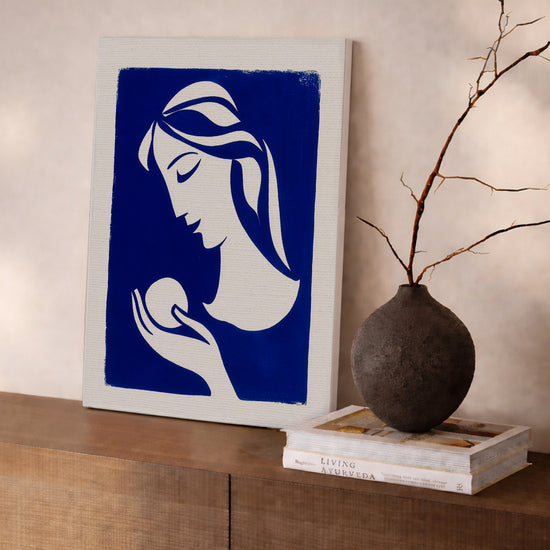 Modern wall art above sideboard: white female silhouette on deep blue, Matisse-style canvas