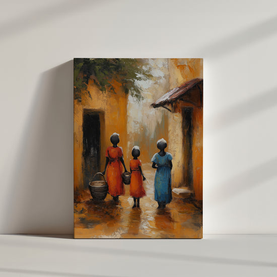Tableau représentant trois femmes africaines en robes colorées marchant dans une ruelle ocre. L’ambiance chaleureuse et traditionnelle apporte une touche ethnique idéale pour une décoration murale inspirée du voyage.