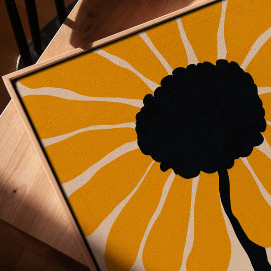 Sun-inspired abstract flower wall art for a minimalist living room, golden oak frame