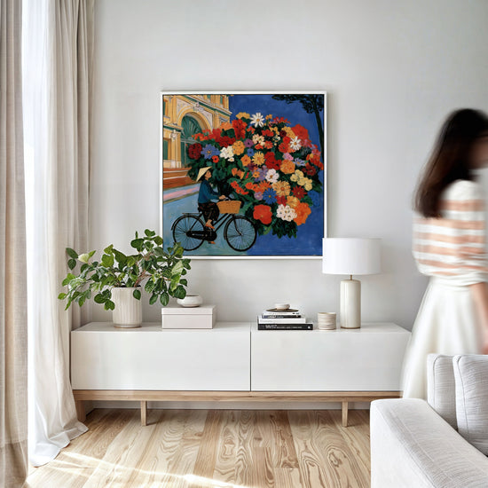 Statement canvas of a colorful bouquet on a bicycle, perfect for minimalist modern living room