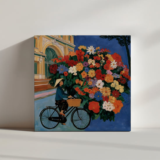Product view: whimsical bicycle-and-flowers canvas leaning on wall, modern wall decor
