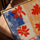 Tableau fleurs rouges abstraites contraste bleu orange pour salon minimaliste