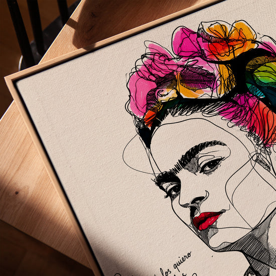 Frida Kahlo wall art with vivid pink and orange flowers, modern line art portrait in a golden oak frame for living room decor