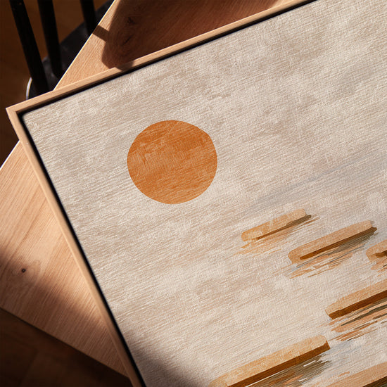 Tableau galets flottants et soleil apaisant pour salon minimaliste