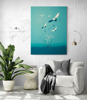 Sleek reading nook with a white armchair, gray cushion, and matching throw. A marine-inspired wall art features stylized birds soaring over a calm sea, creating a serene ambiance in a modern, plant-filled style.