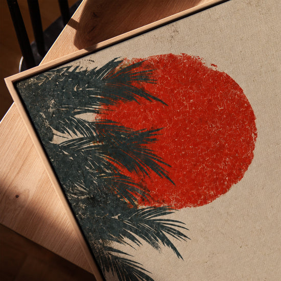 Tableau japonais soleil rouge et branches de pin zen avec bols de thé, cadre chêne doré sur table