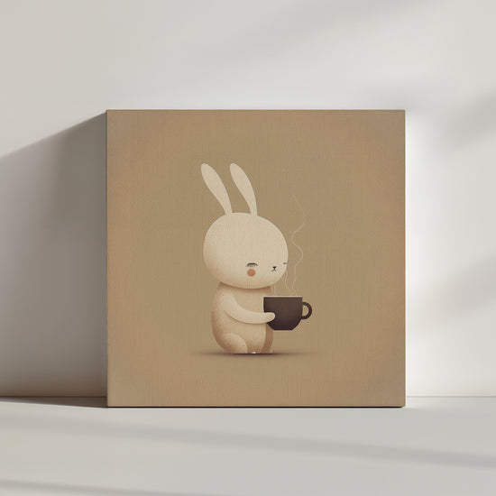 Canvas wall art of an adorable rabbit inhaling the scent of hot cocoa from its cup. Pastel and taupe palette softens the scene, bringing calm and serenity; chocolate brown hues suggest flavor and warmth.