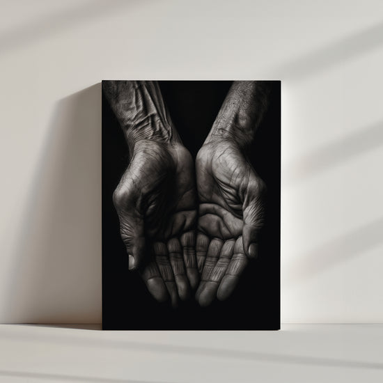 Striking contrast between a dark background and clasped hands in a storytelling black and white wall art print