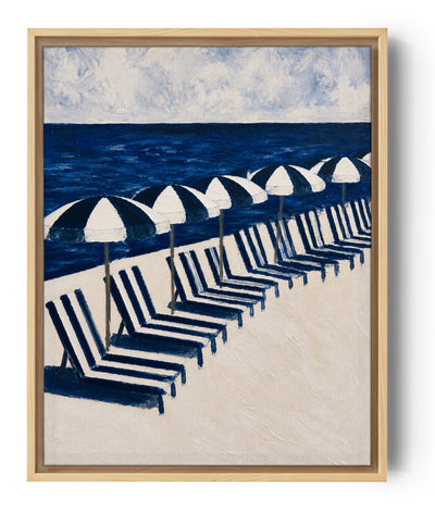 Beach canvas wall art with blue and white striped deck chairs and umbrellas, deep ocean and cloudy sky