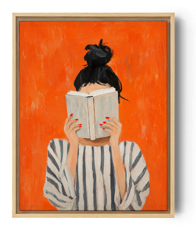 Woman reading canvas print with a vibrant orange backdrop and striped top, minimalist wall art