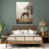 Wall art of a horse grazing near a barn in a calming country ambiance