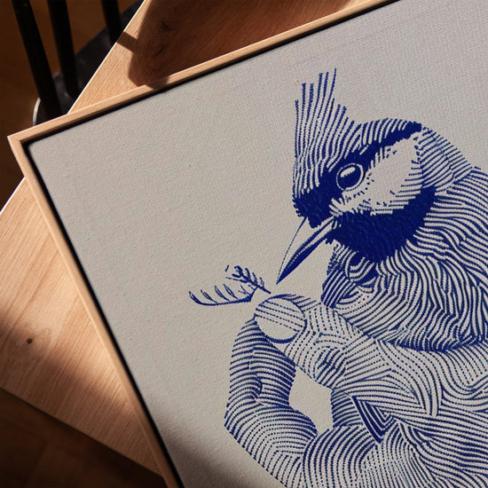 Oiseau sur main tableau line art bleu pour salon minimaliste