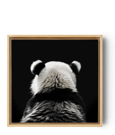 Fotoleinwand eines wunderschönen schwarz-weißen Pandas von hinten