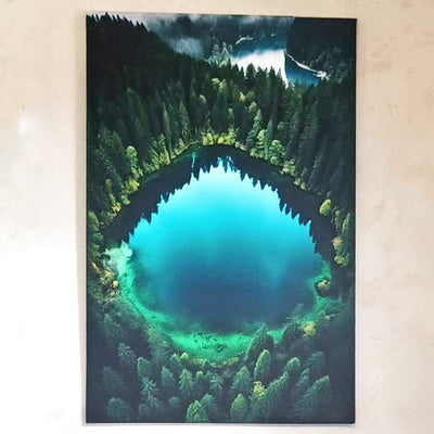 Customer review: panoramic art print of a heart-shaped turquoise lake surrounded by forest, hung on the wall to add a touch of nature and serenity indoors.