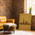 Tableau paysage Paris vintage Tour Eiffel fond jaune décoration salon mur brique fauteuil cuir camel
